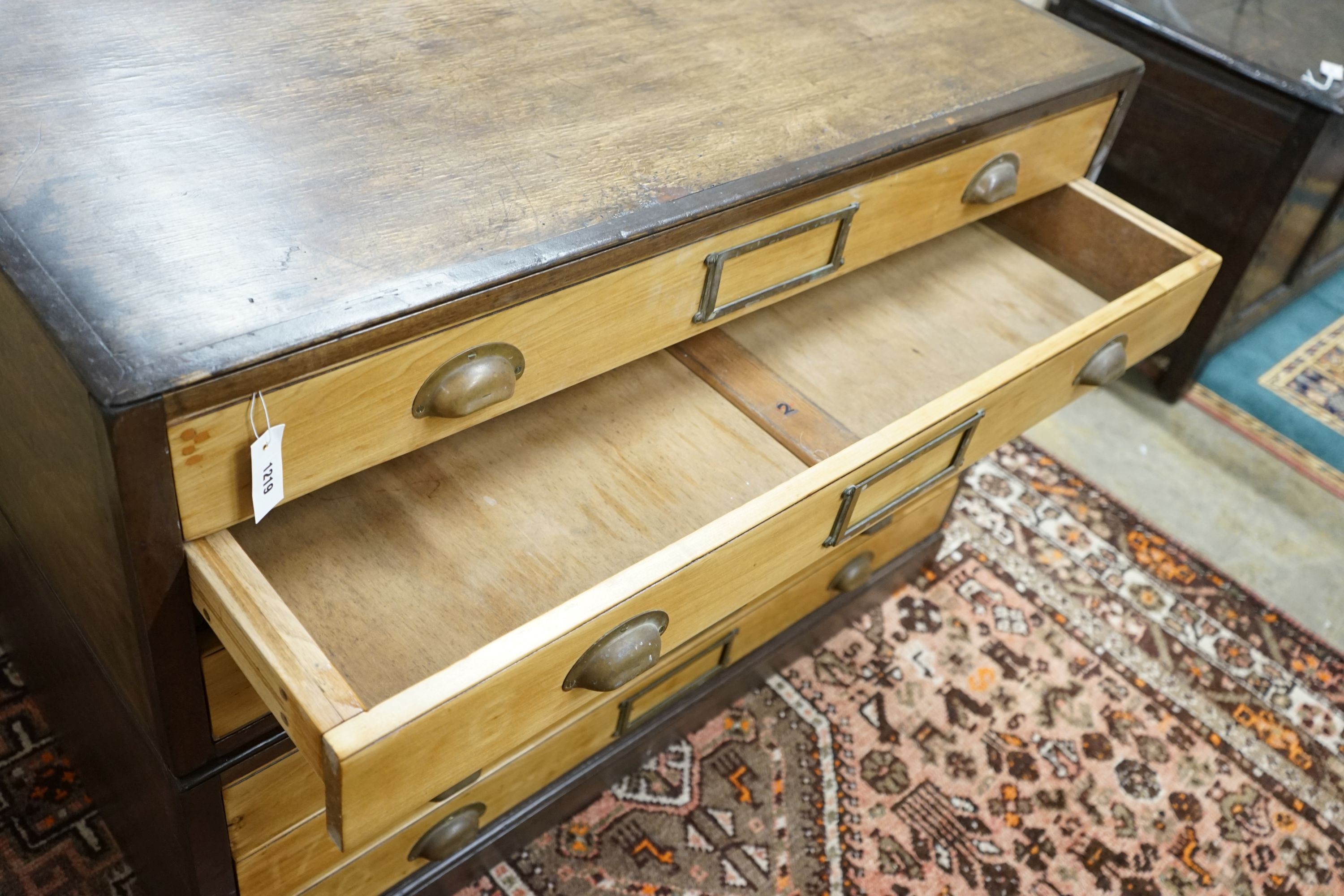 An early 20th century oak and beech six drawer plan chest, width 120cm, depth 89cm, height 86cm